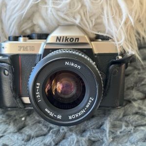 Nikon FM 10 with lens 35-70mm. Great camera!